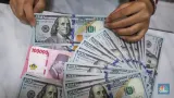 Rupiah Lanjut Melemah ke Rp18.055 per Dolar AS di Tengah Masa Transisi Kepemimpinan Bank Indonesia